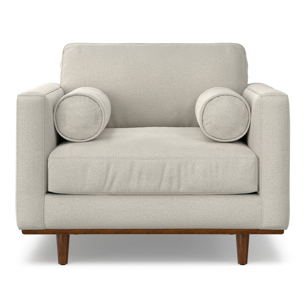 Front view of Modern Armchair Cream White - Morrison Collection featuring plush cushions, bolster pillows, and tapered wood legs.