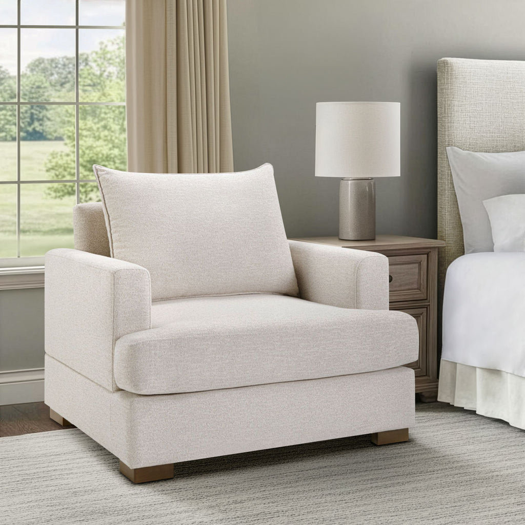 Oversized Beige Upholstered Armchair with Deep Padded Comfort