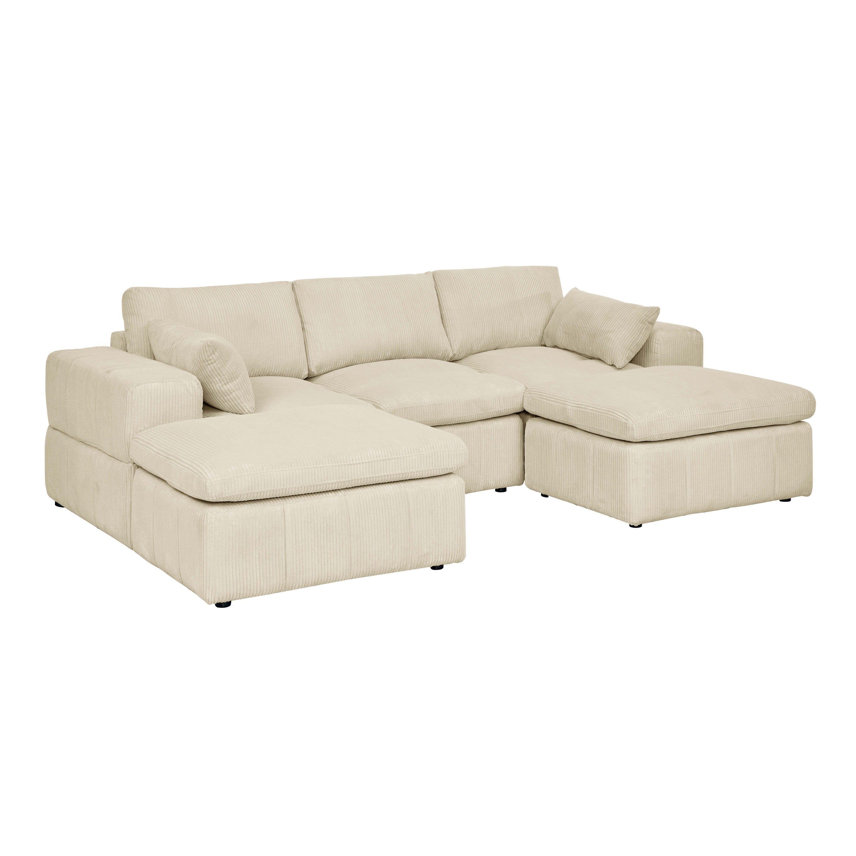 Angled view of beige corduroy sectional with large arms and ottomans. Customizable layout with supportive back cushions and toss pillows.