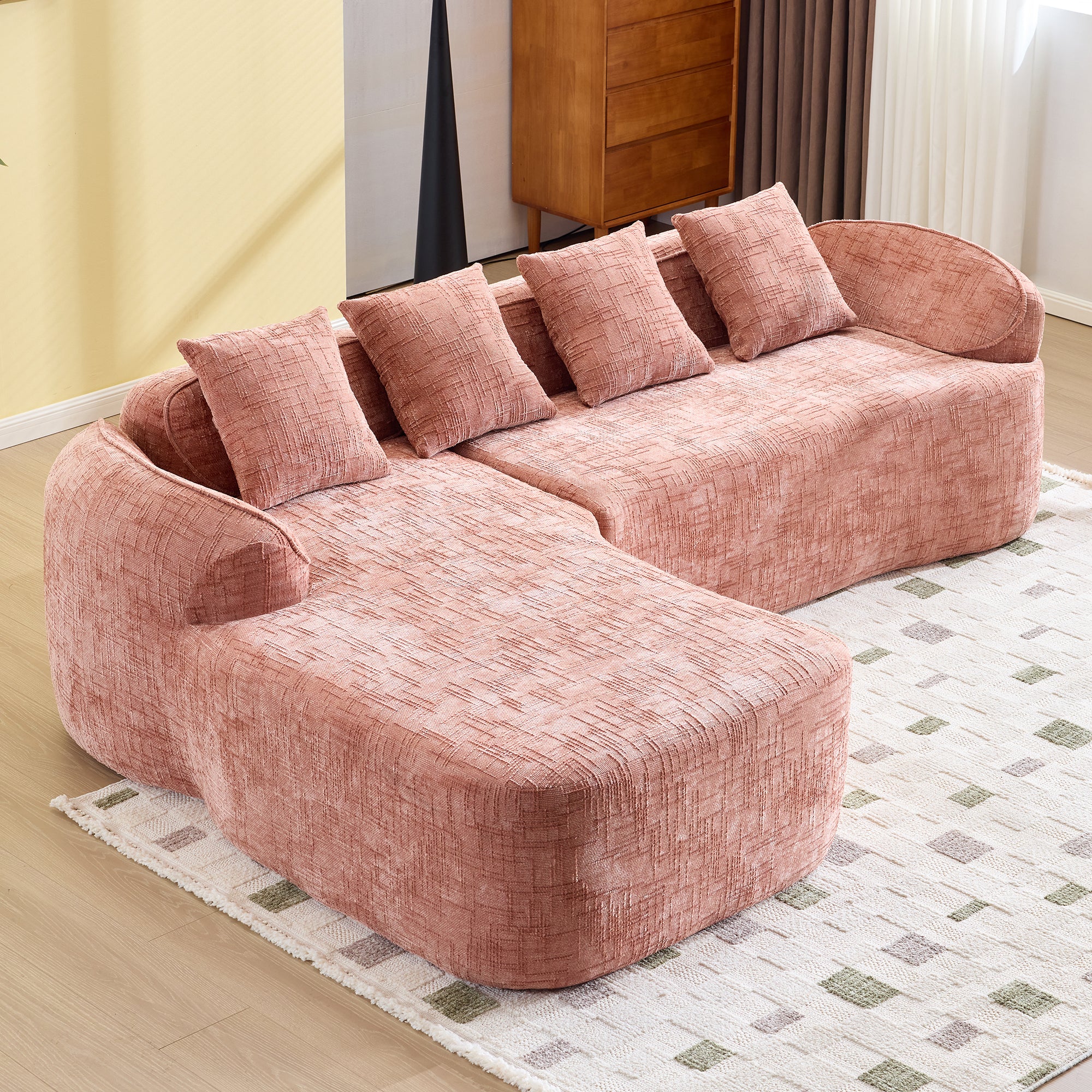 Angled view of Pink Chenille L-Shaped Sofa showing soft chenille texture and ergonomic backrest, perfect for compact living spaces.