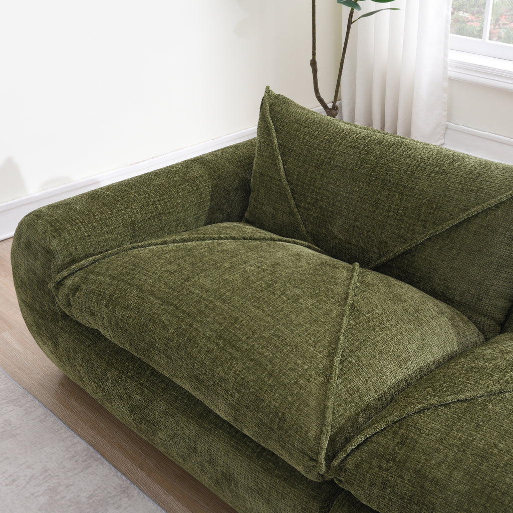 Top view of armrest and cushion on green 116'' compressed sofa, highlighting thick padding and no-assembly convenience.