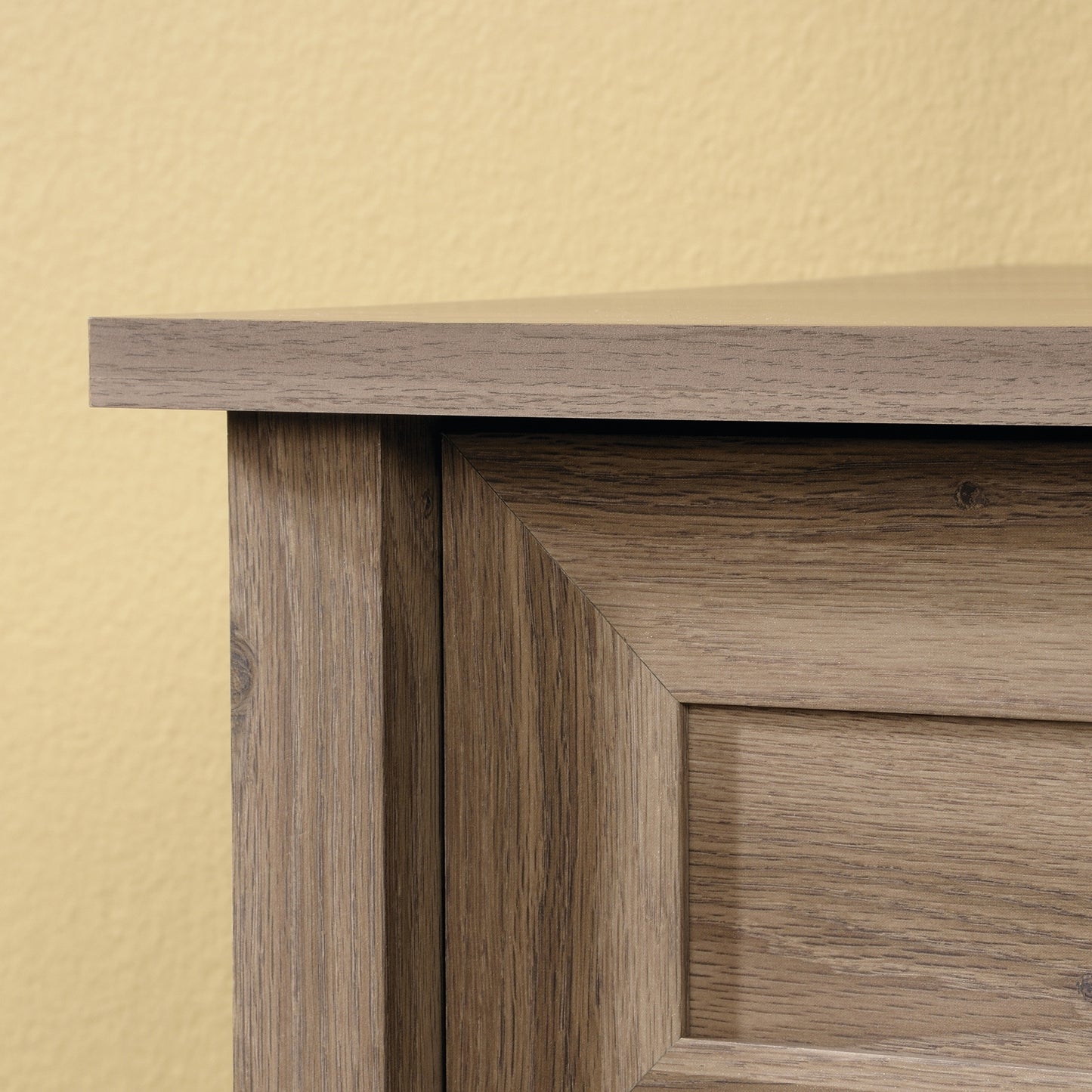 Corner detail of the brown dresser with transitional frame design and clean lines, emphasizing craftsmanship and rustic appeal.