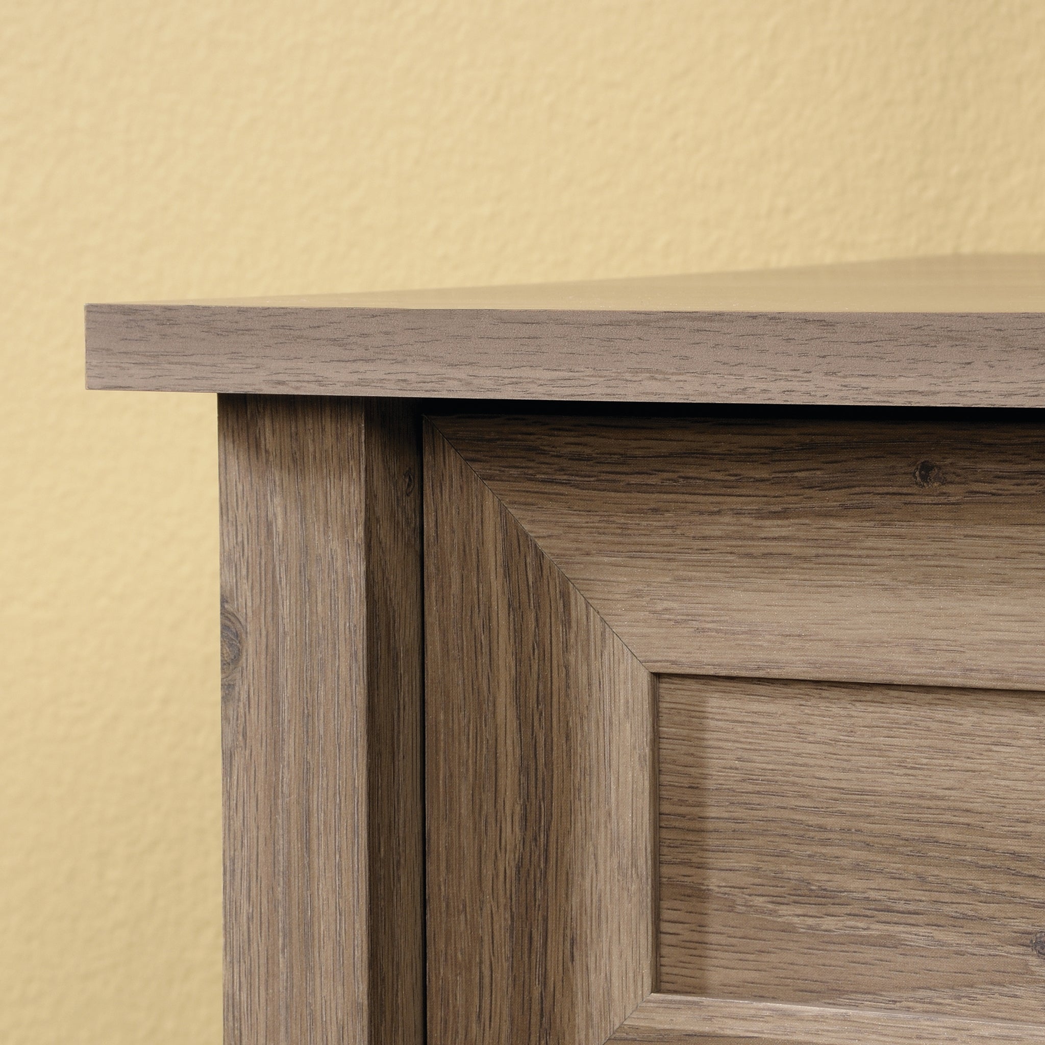 Corner detail of the brown dresser with transitional frame design and clean lines, emphasizing craftsmanship and rustic appeal.