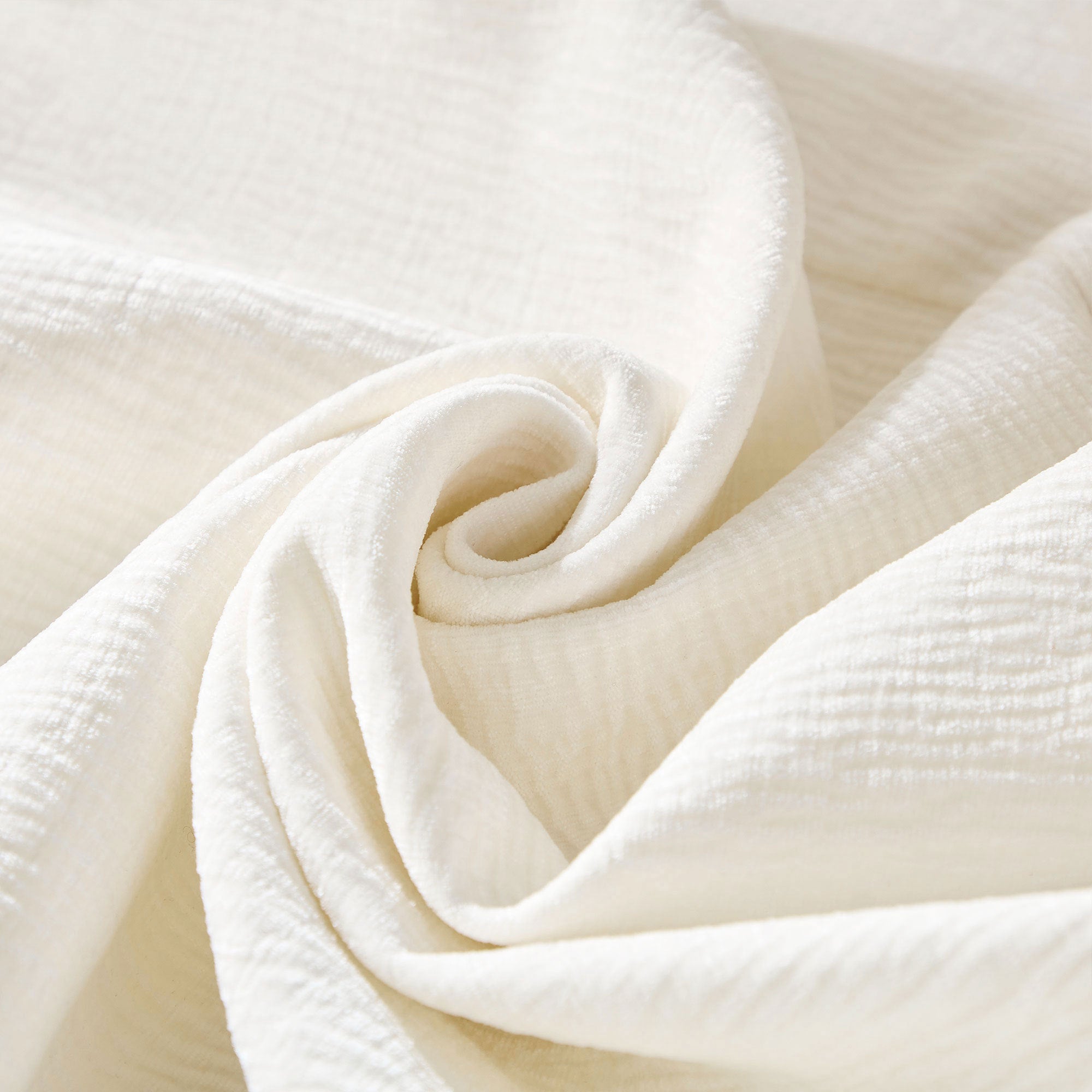 Close-up of soft beige fabric texture used in the Oversized L-Shape Sectional Sofa with Chaise, showcasing its premium quality.