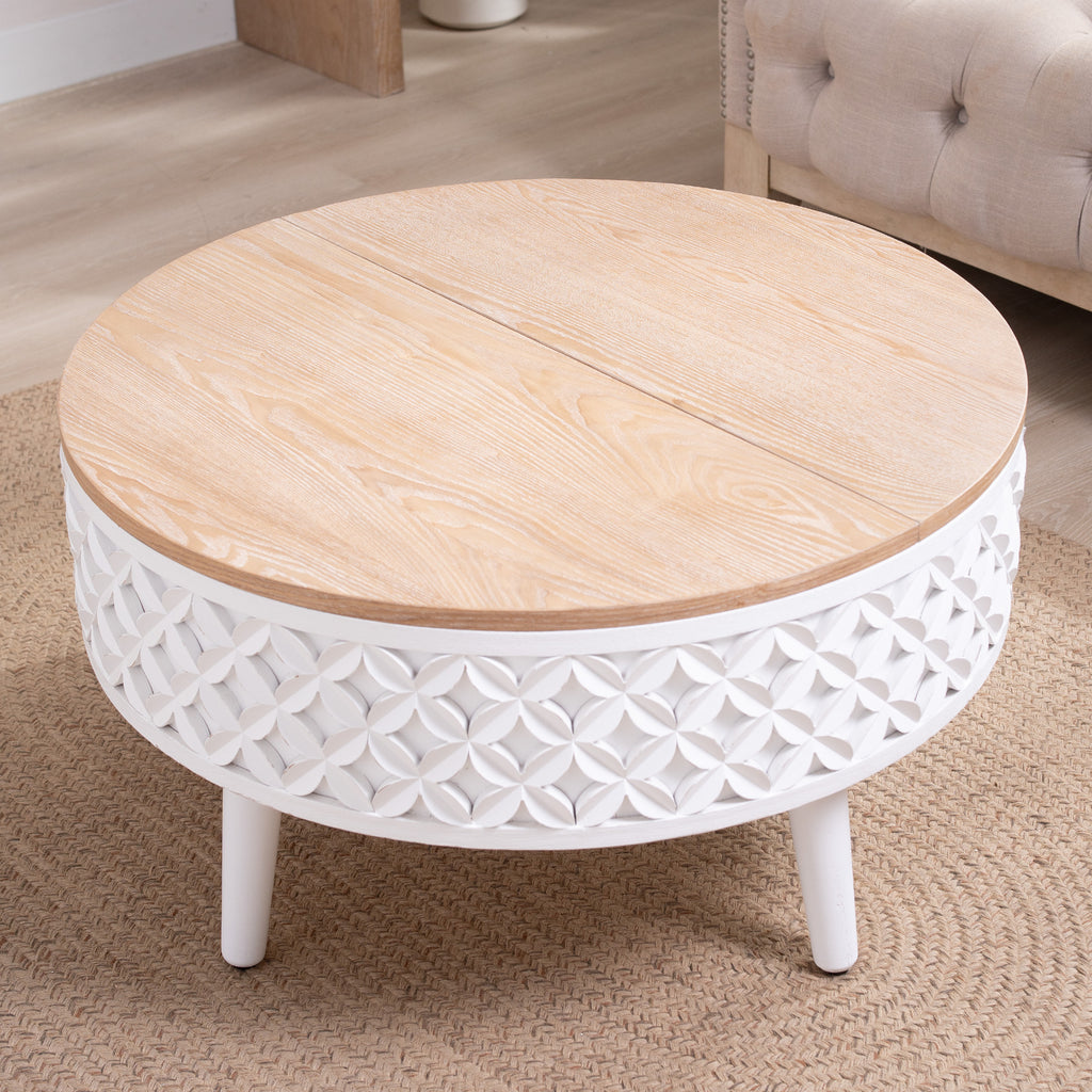 Closed round coffee table with white carved base and natural wood top, ideal for boho and farmhouse living room settings.