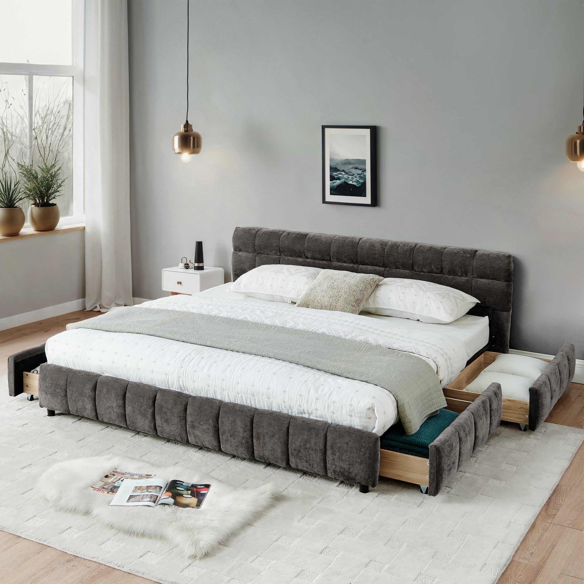 California King upholstered bed in dark gray chenille with open storage drawers, styled in a modern bedroom with pendant lights and white rug.