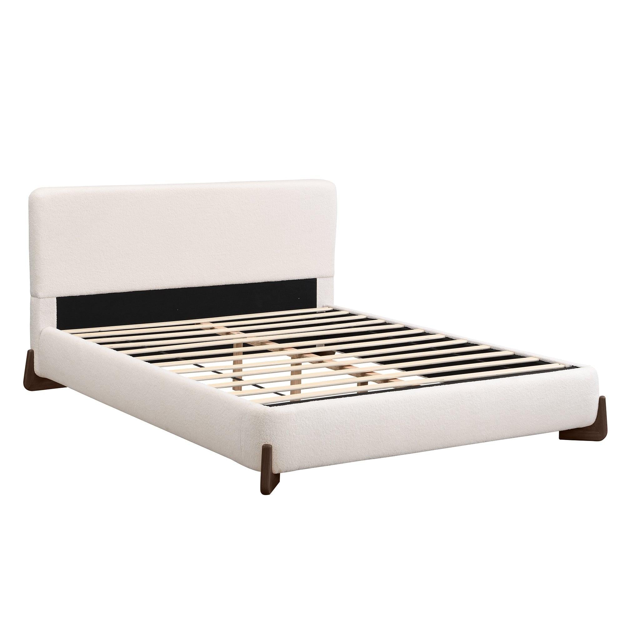 White Upholstered Queen Bed with Solid Wood Legs.