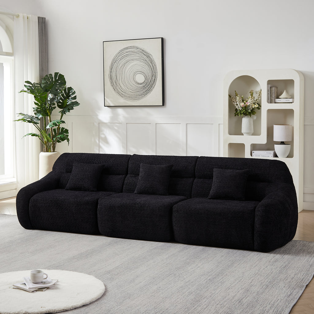 Full-length 4-seater Modern Black Modular Sofa in chenille, styled against a white wall with modern decor and soft area rug.