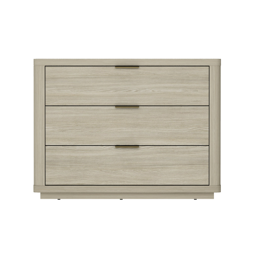 Modern three-drawer nightstand in a natural wood finish with sleek, slim brass-tone metal pulls.