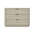 Modern three-drawer nightstand in a natural wood finish with sleek, slim brass-tone metal pulls.
