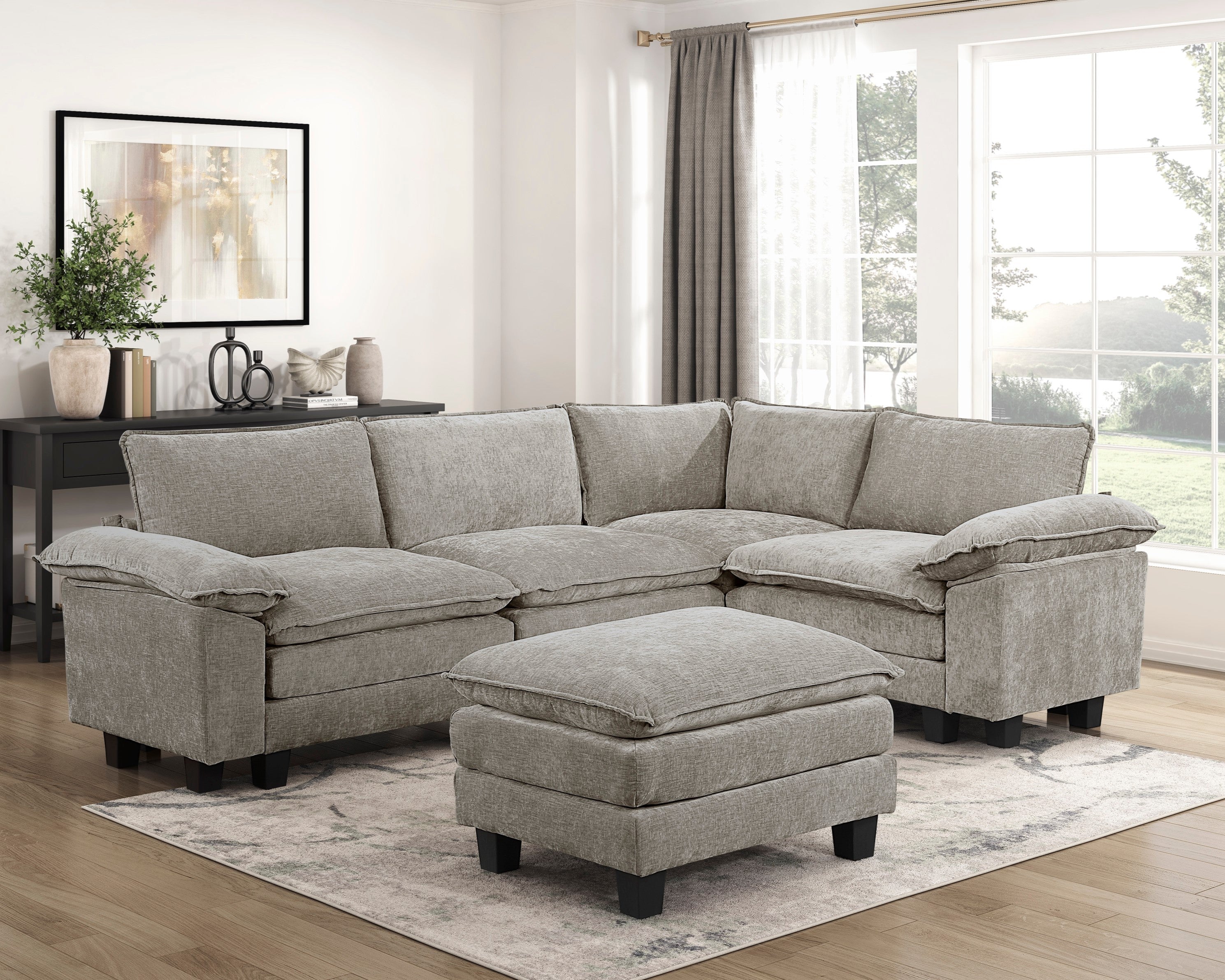 Modern 5-piece modular sectional in gray chenille fabric with a matching plush ottoman on a light area rug.