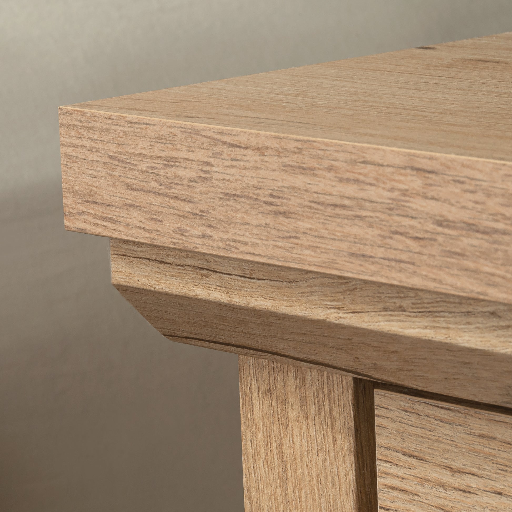 Detailed corner view of the night stand's top surface and trim, emphasizing craftsmanship and natural wood texture in brown finish.