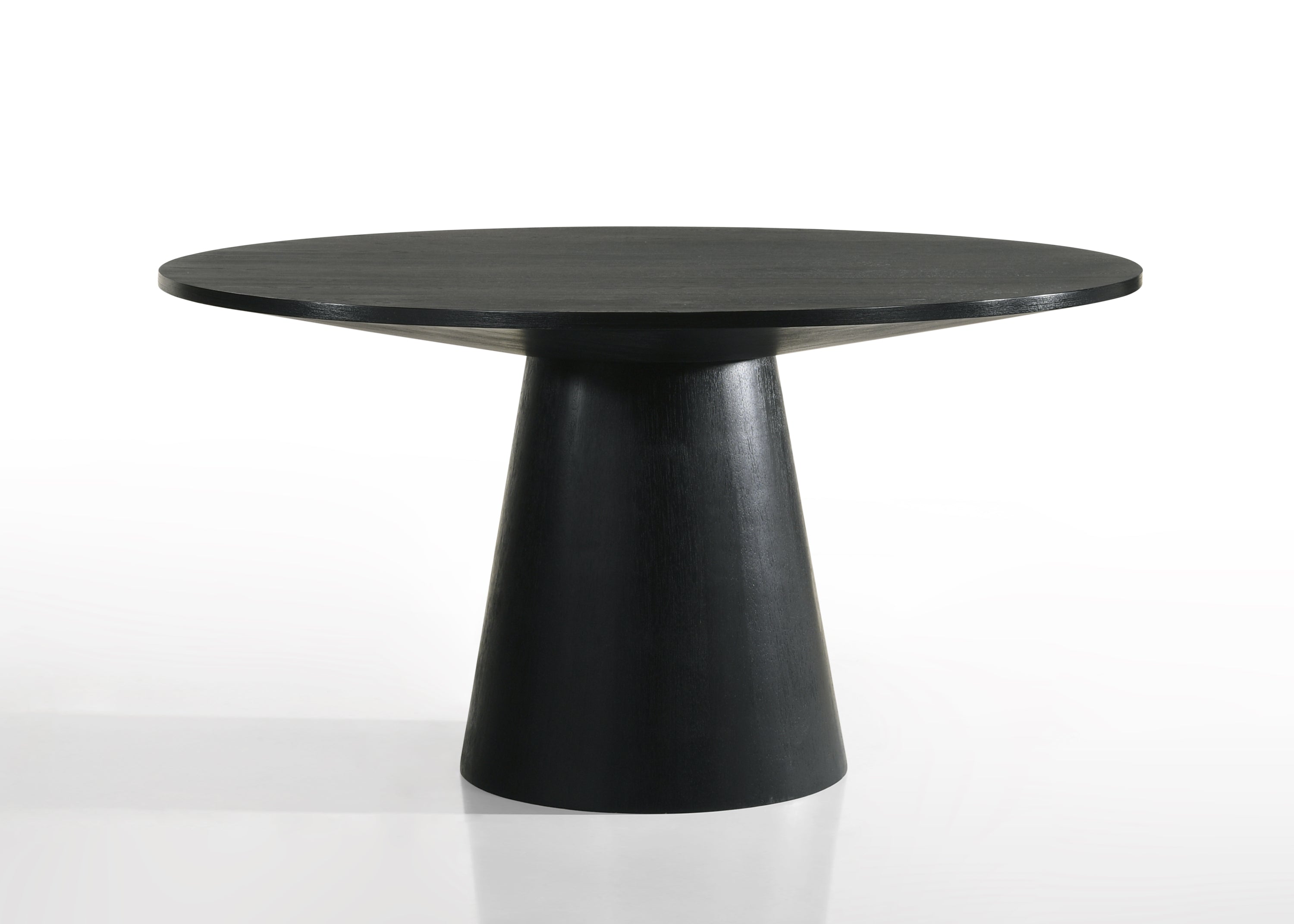 Jasper round dining table in ebony black wood with pedestal base. Minimalist design for modern dining rooms.