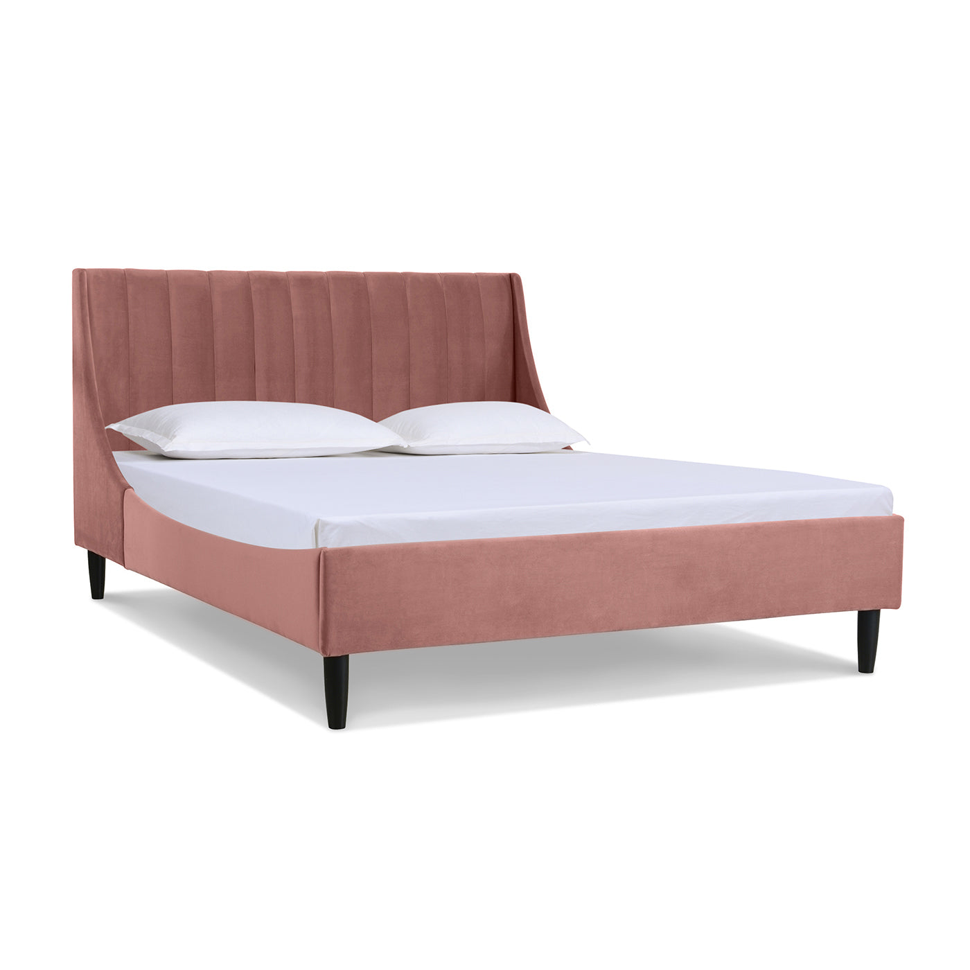 Angled view of Aspen Pink Velvet Queen Headboard Bed with vertical tufting and low-profile frame. Modern platform bed design.