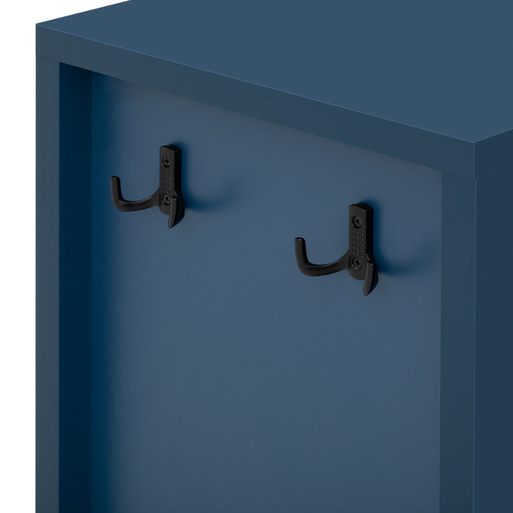 Close-up of black metal hooks on modern navy sideboard side panel. Versatile use for hanging items in entryways or living rooms.