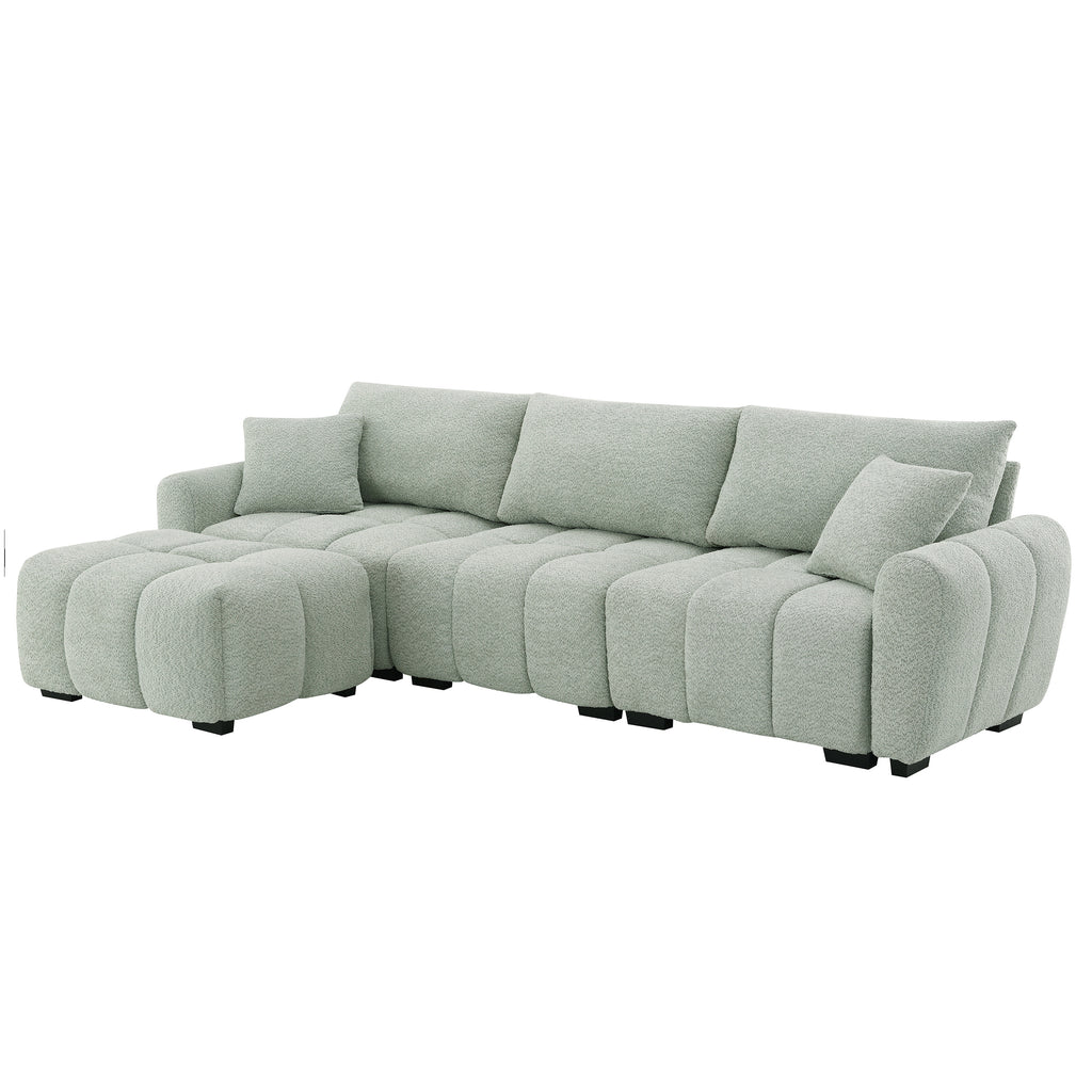 Angled view of modular sectional sofa with ottoman in left-facing setup, highlighting plush design and modern silhouette.