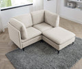 Beige linen modular sectional sofa with plush cushions and black metal legs, set on a gray rug.