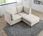 Beige linen modular sectional sofa with plush cushions and black metal legs, set on a gray rug.