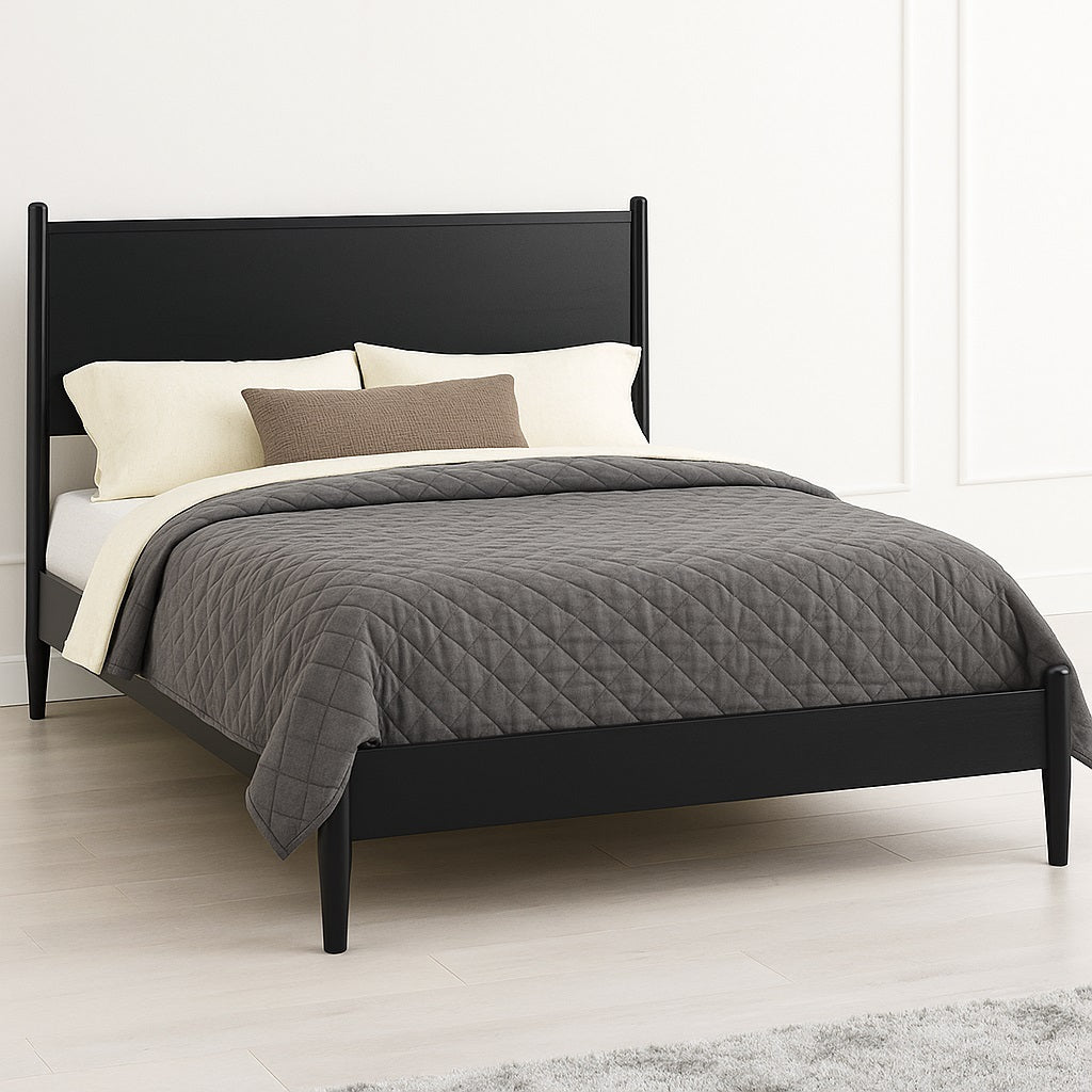 Black finish Mid-Century Modern Queen Size Platform Bed with slanted legs and minimalist headboard, staged in a bright modern room.