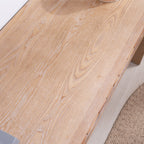 Top surface detail of rustic wood console table, featuring visible wood grain and a smooth, hand-painted finish.
