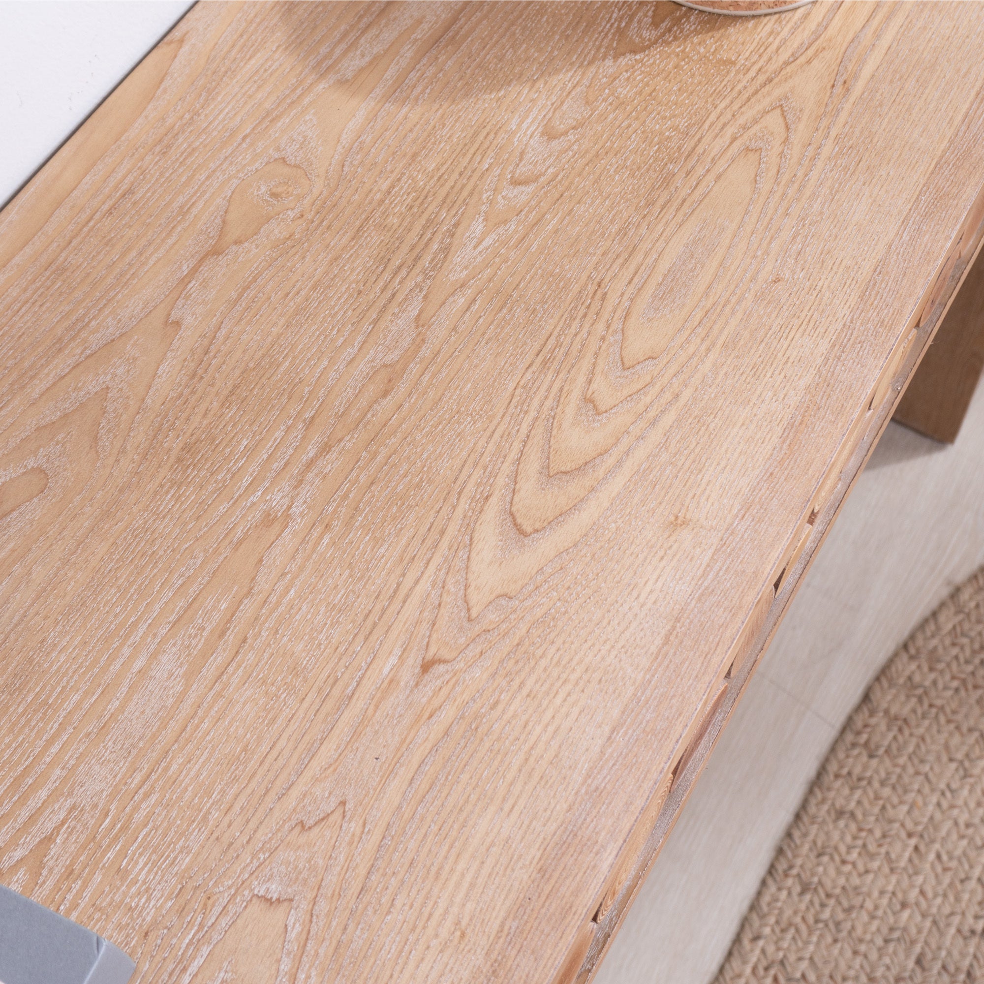Top surface detail of rustic wood console table, featuring visible wood grain and a smooth, hand-painted finish.