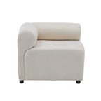 Side view of the Evelyn sectional sofa corner piece with curved armrest and soft chenille fabric in cream color.