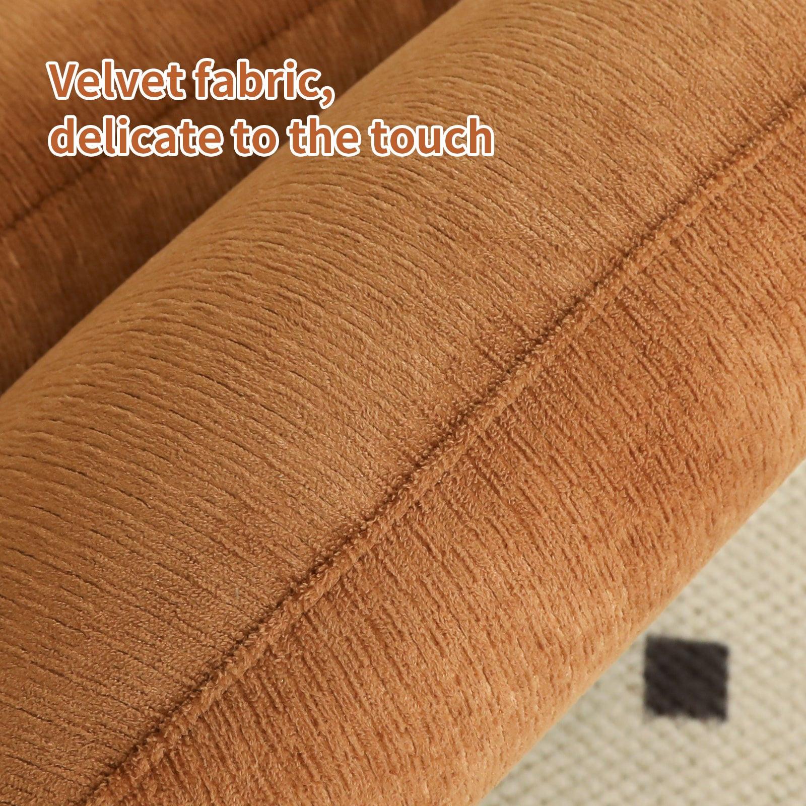 Close-up of velvet fabric on accent chair with solid wood legs, highlighting its soft and delicate texture.
