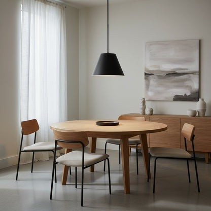 16 inch LED black pendant light over a wooden dining table in a minimalist room. Energy-smart fixture for modern interiors.