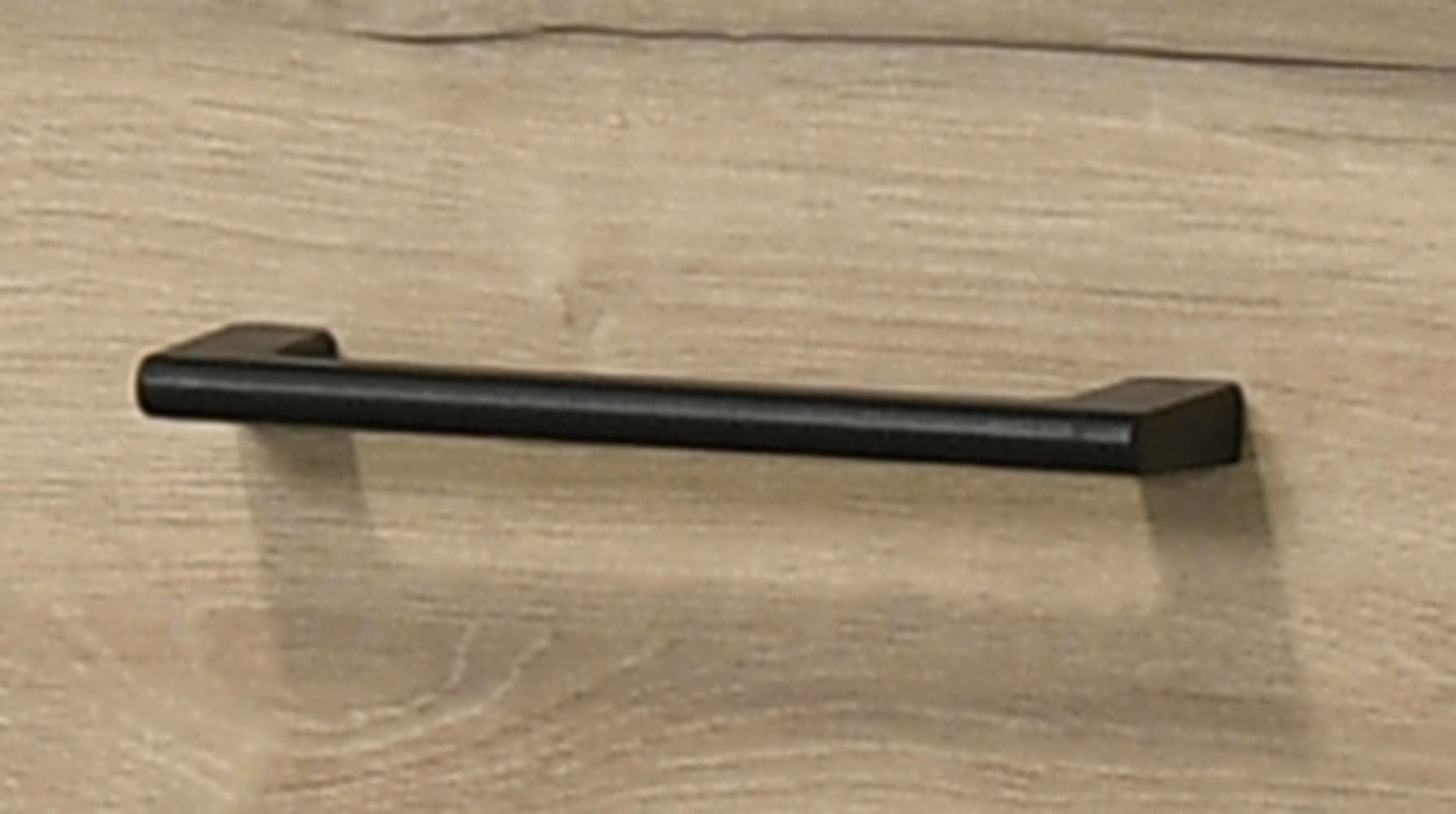 Black metal handle on Light Oak Nightstand with Drawer - Celeste 20' drawer. Adds contrast and easy access to storage space.