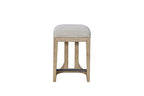 Modern rustic counter-height stool featuring a beige upholstered seat, light wood frame, and a black metal footrest.