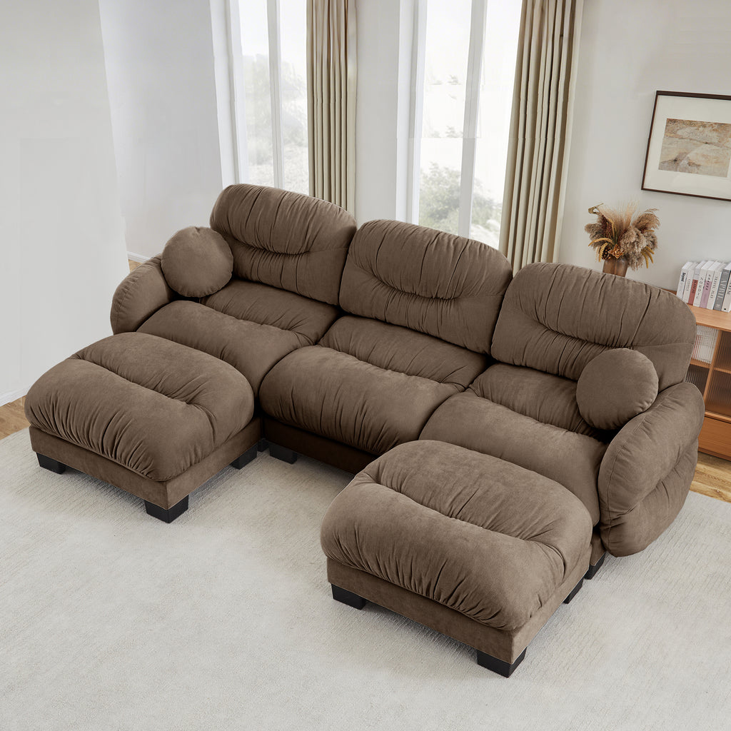 Brown U-shaped sectional sofa in cozy pleated chenille with two ottomans, curved arms, and two round throw pillows.