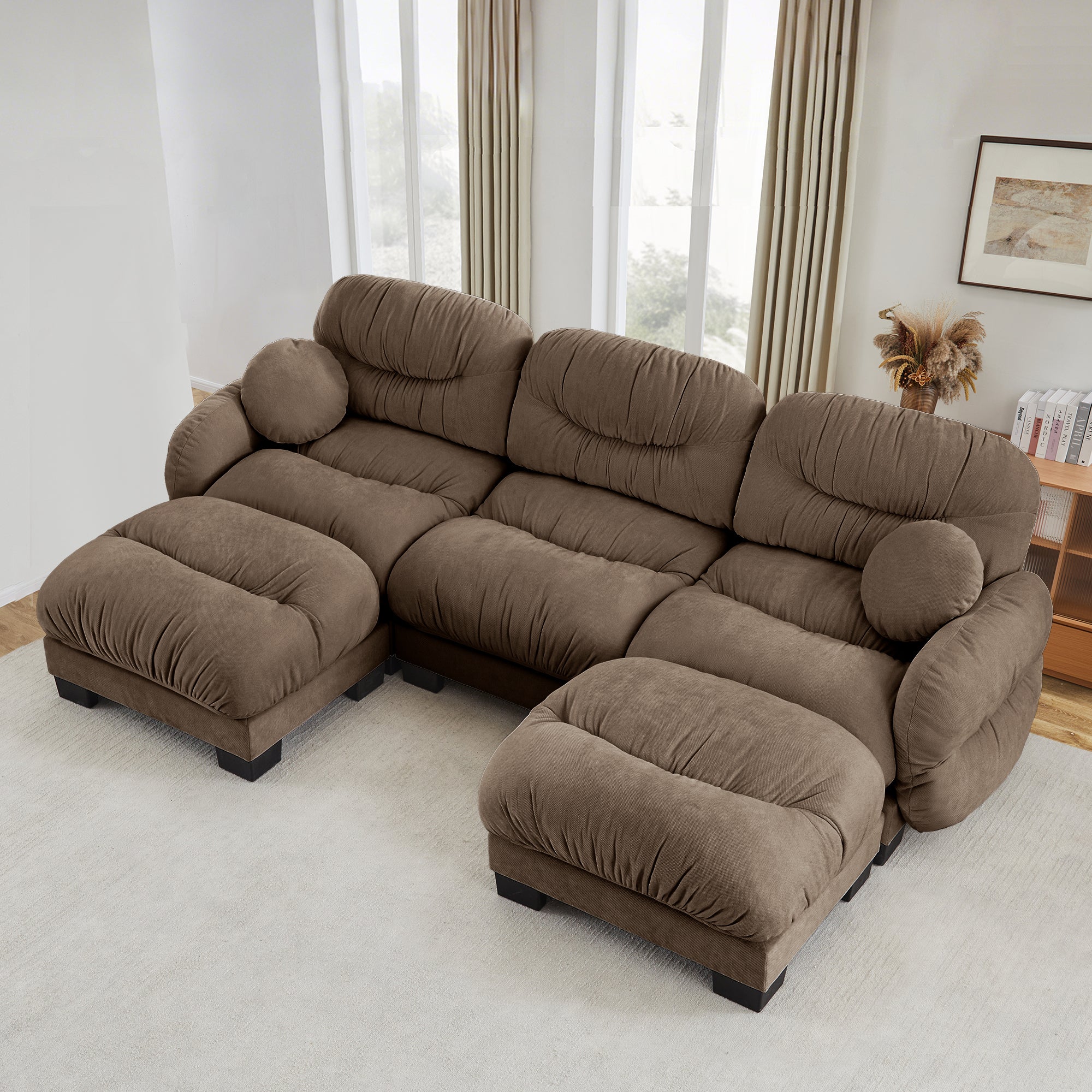 Brown U-shaped sectional sofa in cozy pleated chenille with two ottomans, curved arms, and two round throw pillows.