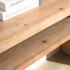 Close-up of lower shelf on rustic console table, displaying wood grain and ample storage space for books or decor.
