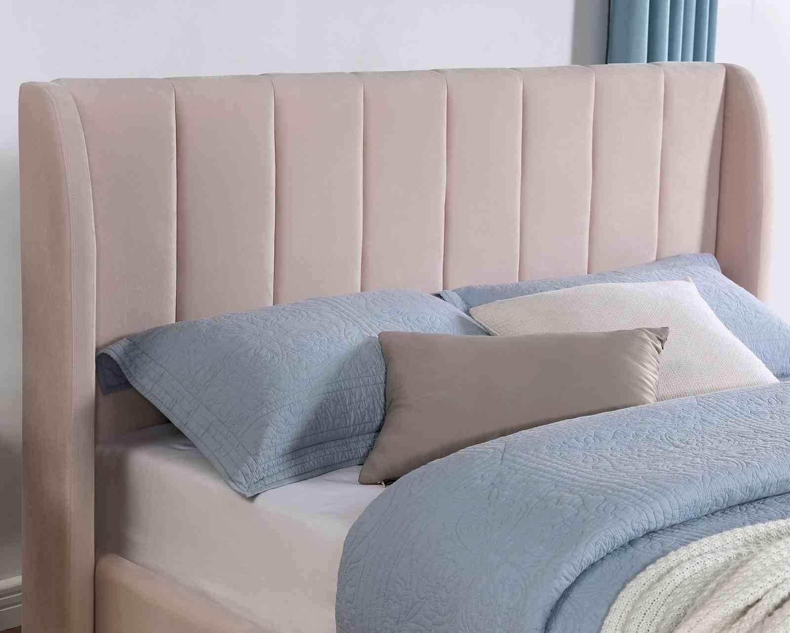 Light Pink Queen Bed with Wingback Headboard.