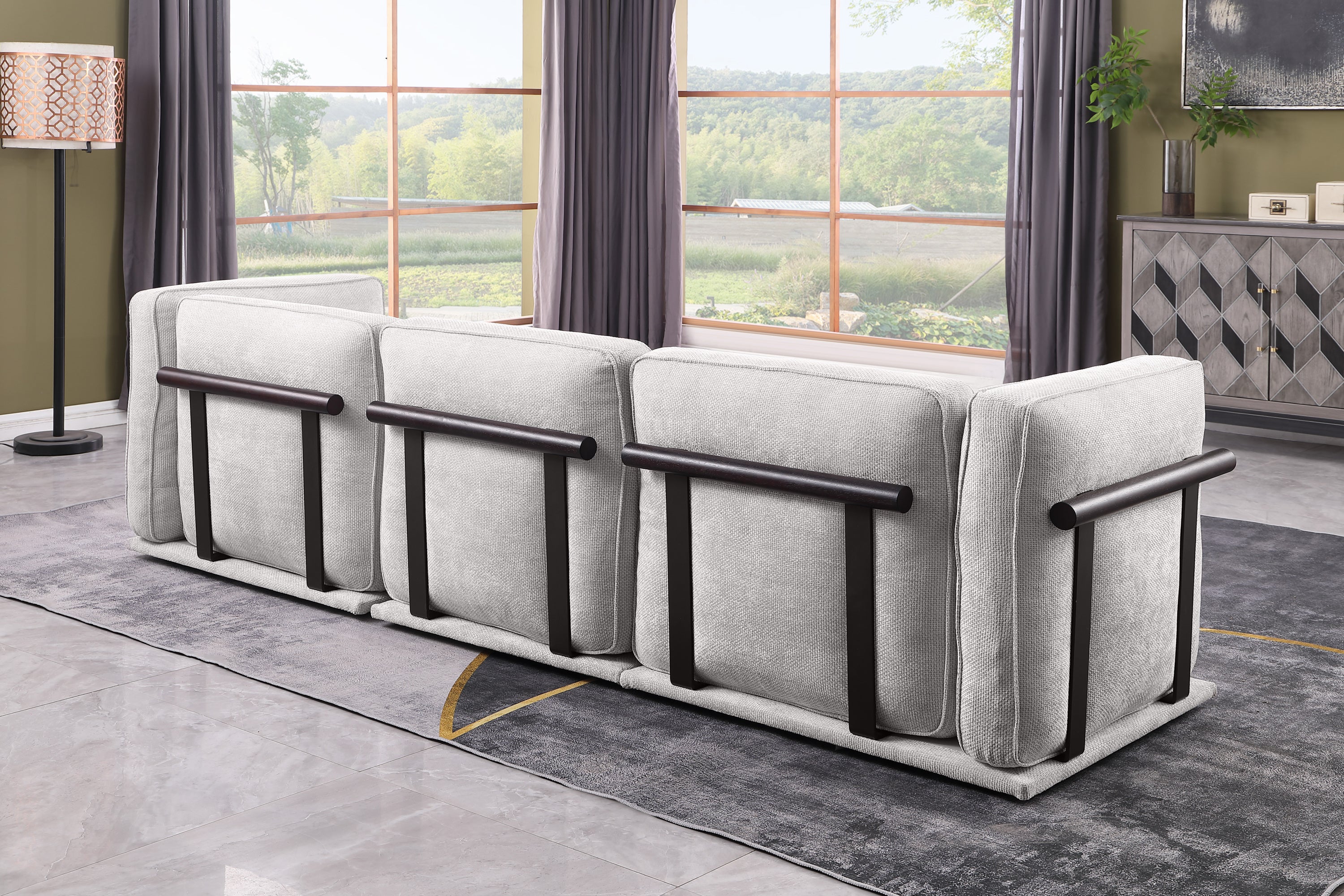 Back view of modular fabric sofa set with dark wood and metal support bars, showcasing modern design and structural detailing.