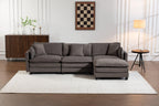 Sectional Sofa with Ottoman centered in elegant room. Neutral tones and modern lines suit a variety of home decor styles.