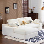 Compressed corduroy sofa in white with 3 back cushions and 2 pillows, featuring a chaise lounge and plush seating for 4 in a cozy living room setup.
