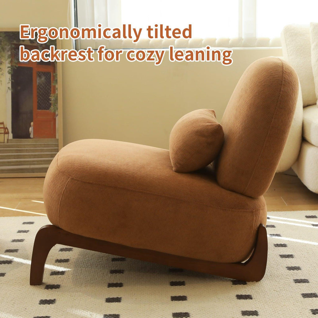 Side view of accent chair with tilted backrest and solid wood legs, offering ergonomic support for cozy seating.
