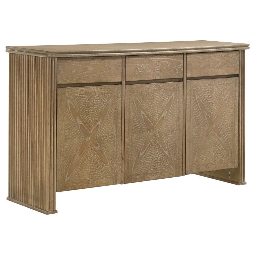 Light brown wood 3-door sideboard with a distressed finish, fluted sides, and geometric patterned cabinet doors.