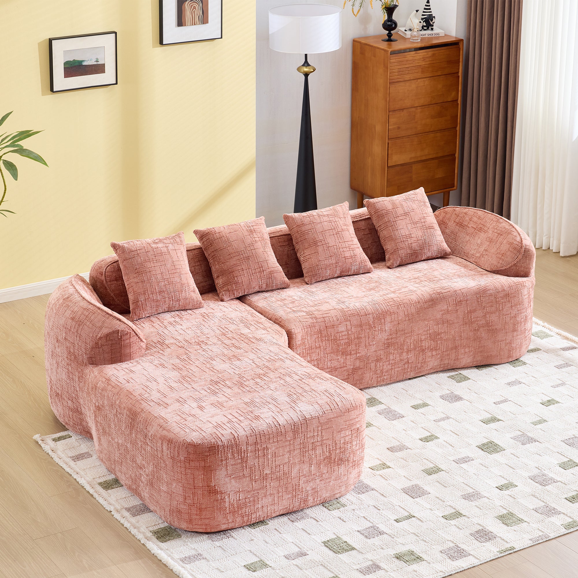 Pink Chenille L-Shaped Sofa with five cushions, ideal for living rooms. Soft chenille fabric and curved armrests enhance comfort and style.