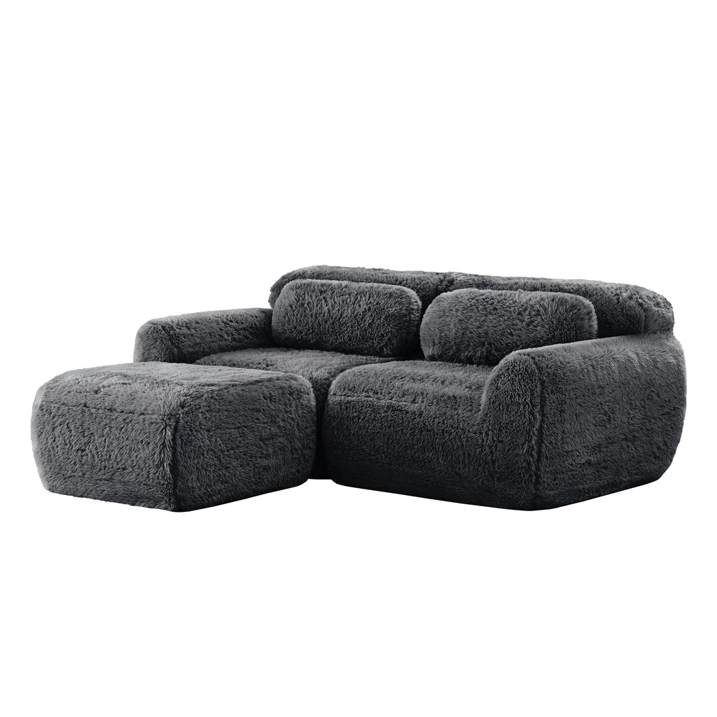 Angled view of dark grey Modular Plush Sectional Sofa with chaise, highlighting its soft, ergonomic build and no-assembly design.