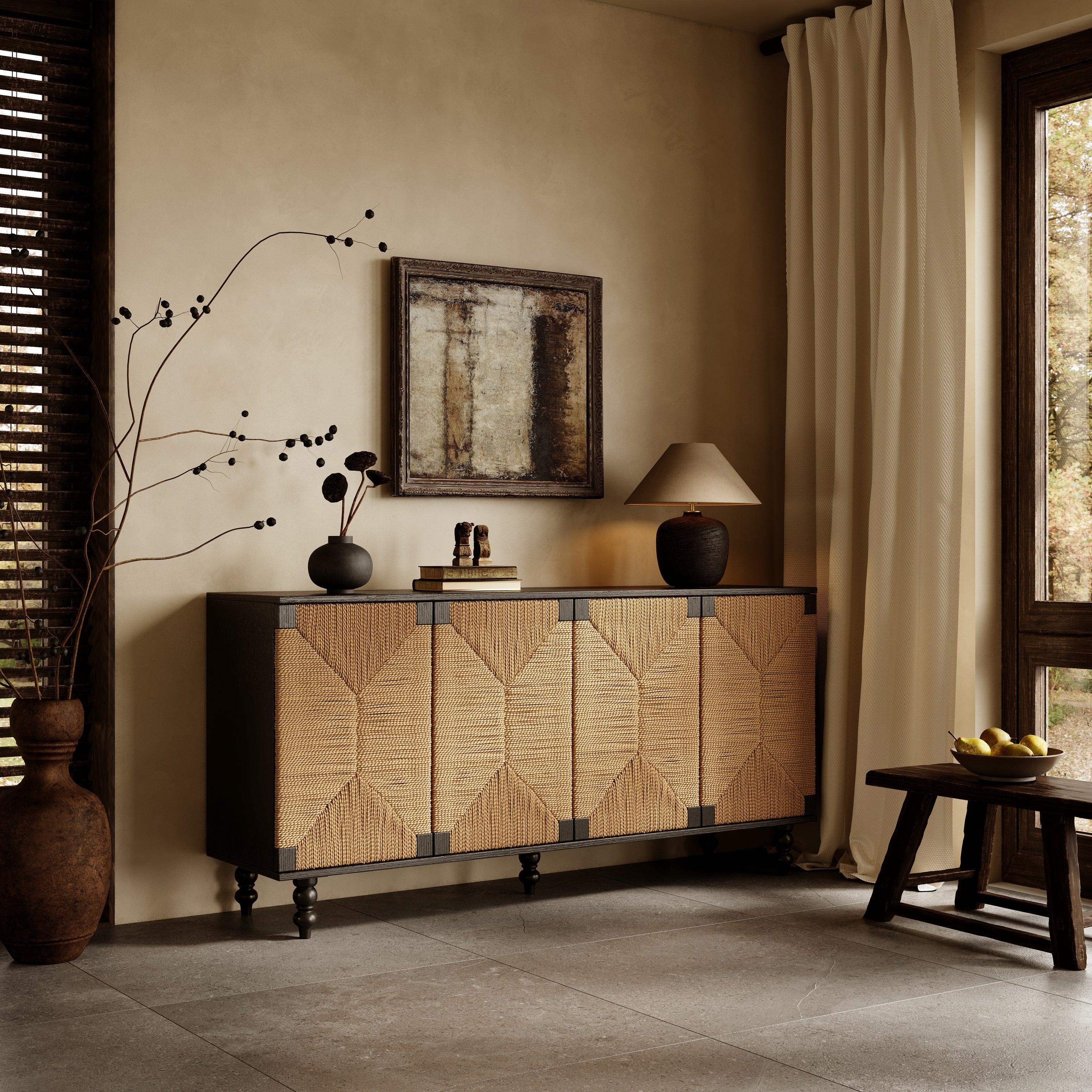 Black wood sideboard with four woven seagrass doors featuring a geometric pattern, set against a warm neutral wall.