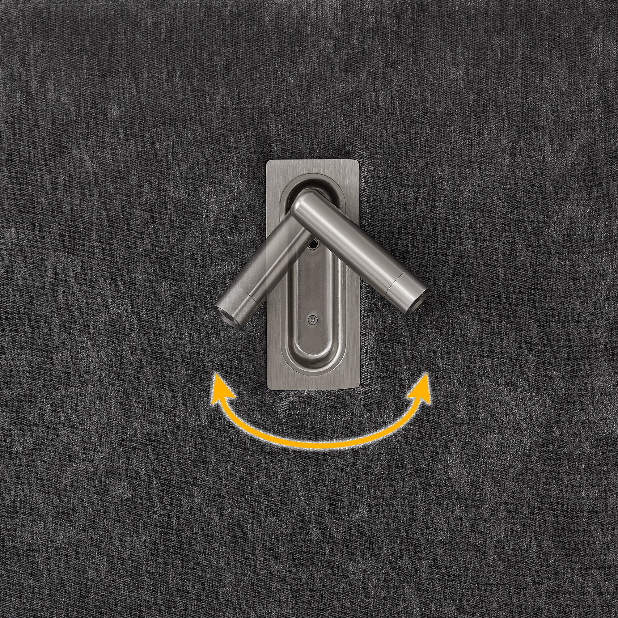 Close-up of adjustable lamp mechanism on queen upholstered bed. Built-in lighting complements solid frame and pleated headboard.