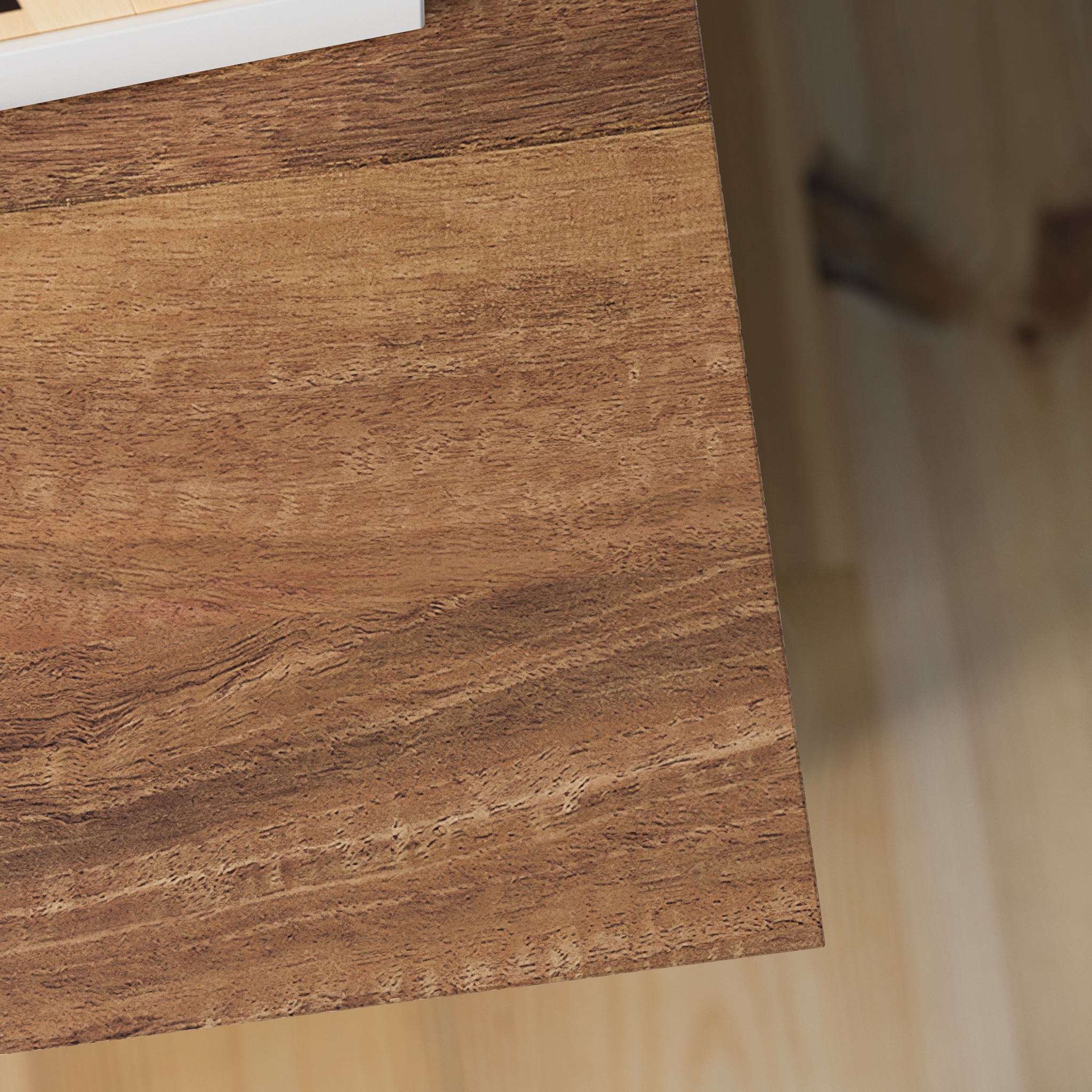 Close-up of wood grain texture on brown lateral file cabinet top, highlighting natural finish and quality craftsmanship.