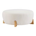 Modish Round Ottoman with Boucle Top and Natural Wood Legs.