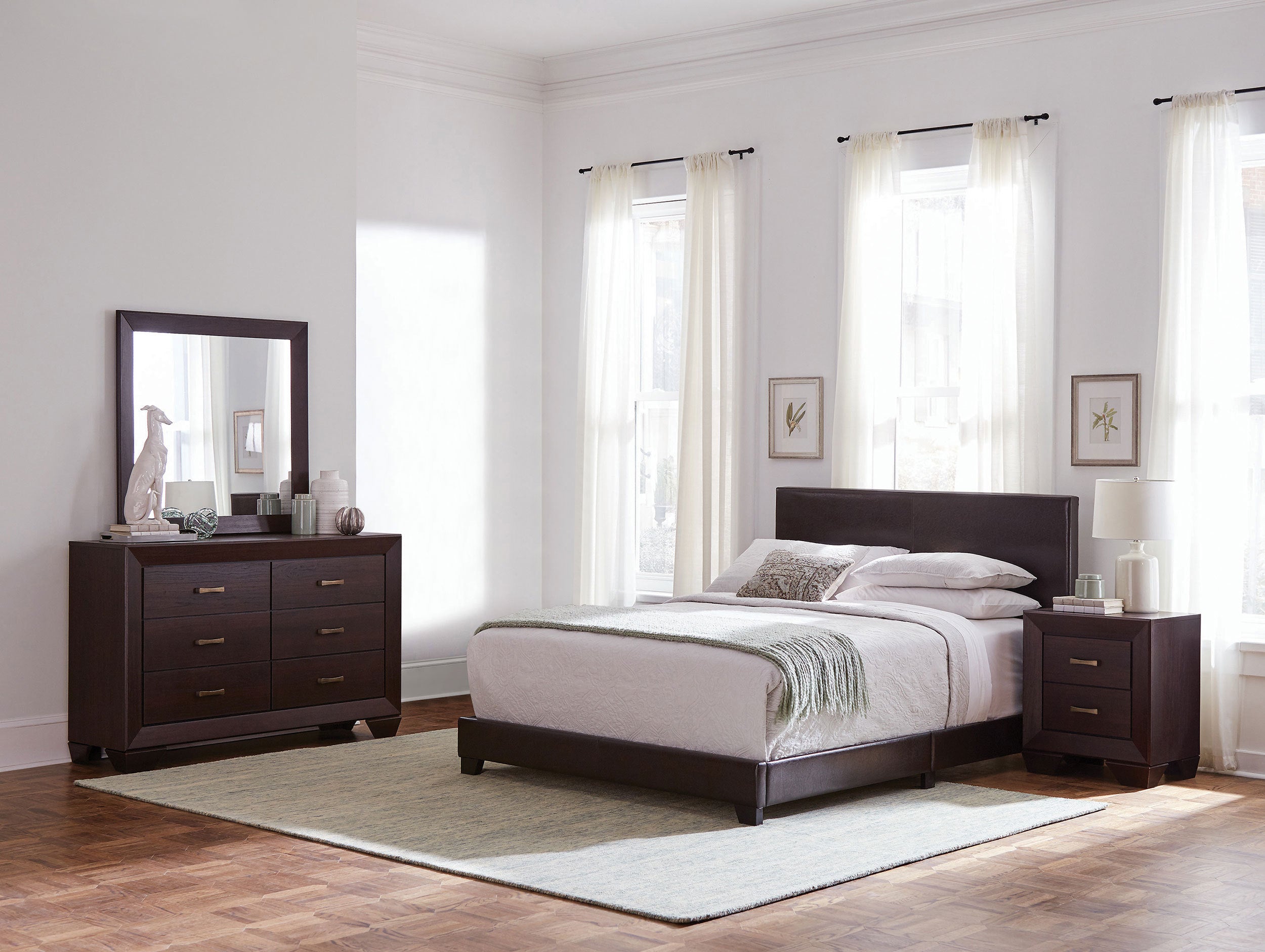 Dark cocoa Eastern king bedroom set with sleek wooden frame, upholstered headboard, dresser with mirror, and nightstand.