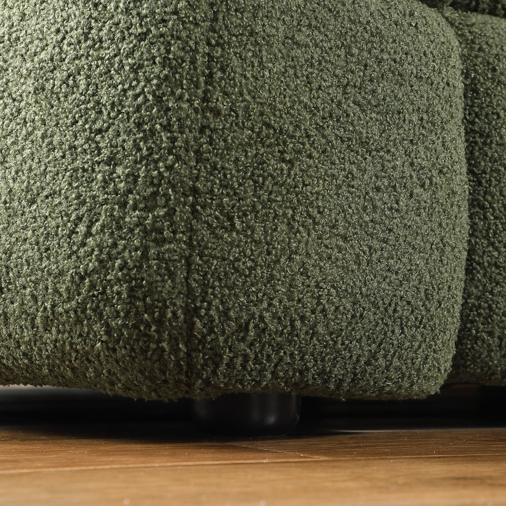 Close-up of sofa leg and base of Olive Green Boucle Sofa - 3 Seater, Marshmallow Cozy with textured boucle upholstery.