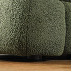 Close-up of sofa leg and base of Olive Green Boucle Sofa - 3 Seater, Marshmallow Cozy with textured boucle upholstery.