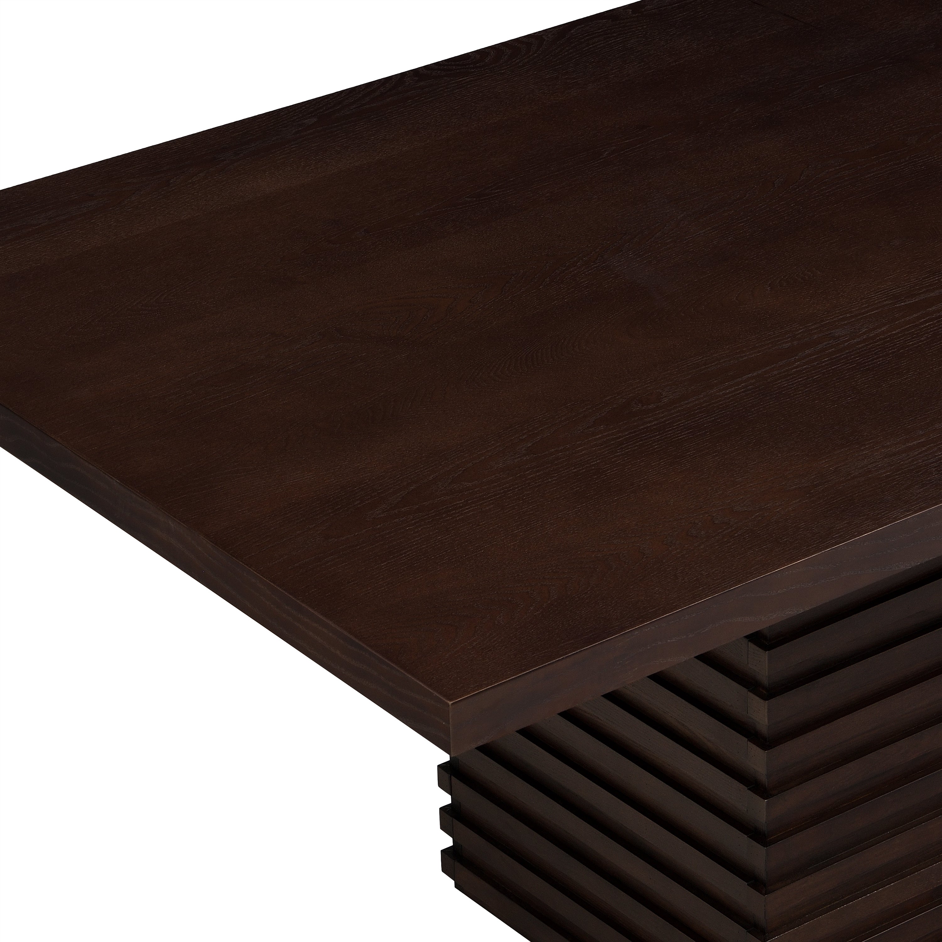 Close-up of the espresso dining table's corner, highlighting the rich wood grain texture and solid craftsmanship of the tabletop.