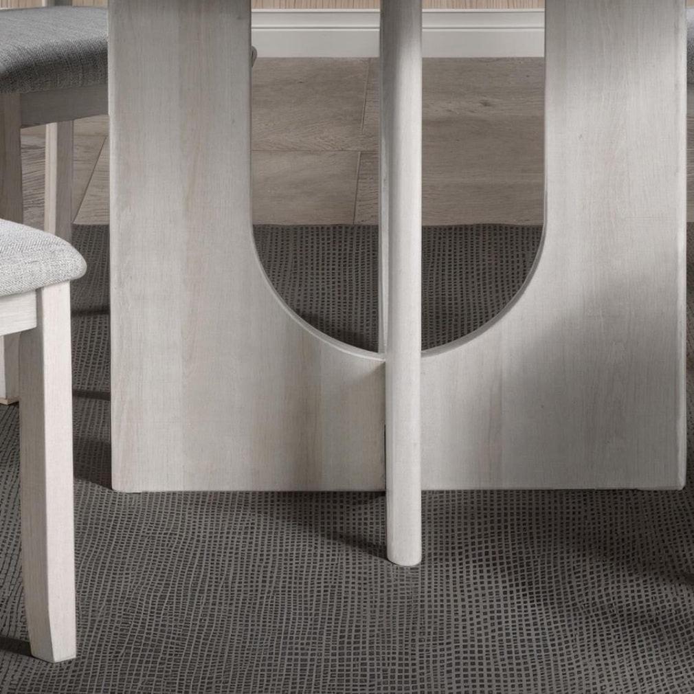 5pc dining set with gray upholstered chairs and round table.